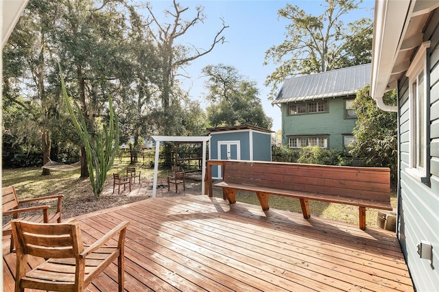 deck featuring a shed