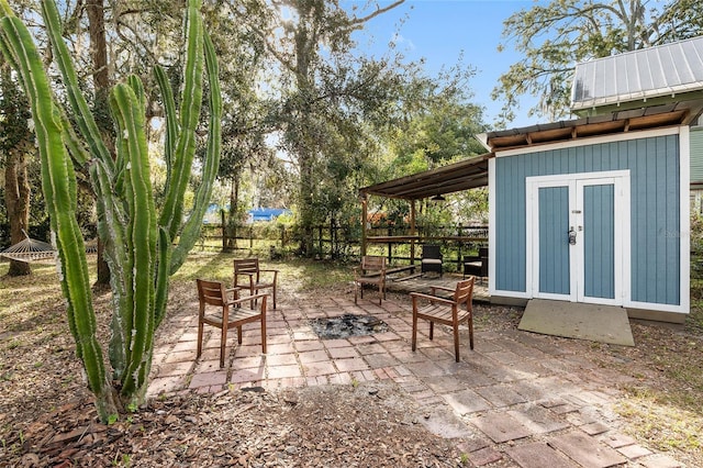 view of patio featuring a shed