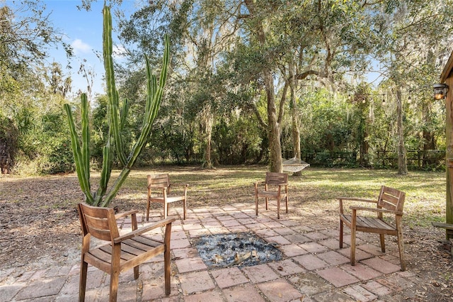 view of patio with a fire pit