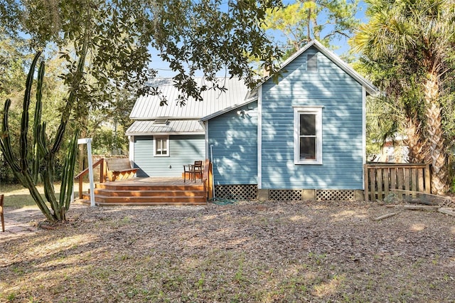 back of property featuring a deck