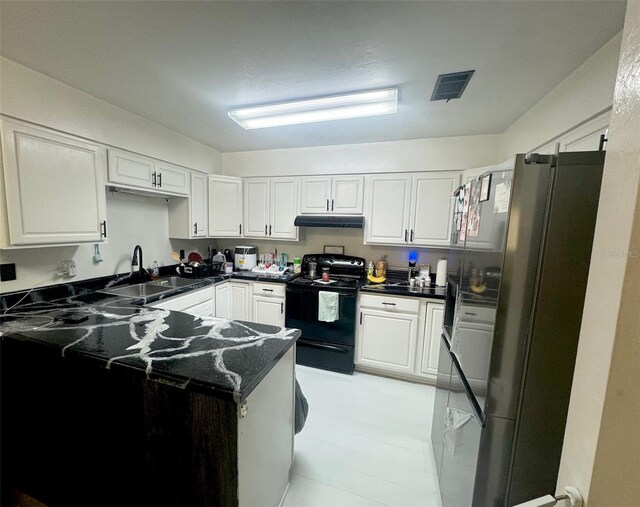 kitchen featuring white cabinets, sink, stainless steel fridge, kitchen peninsula, and black range with electric cooktop