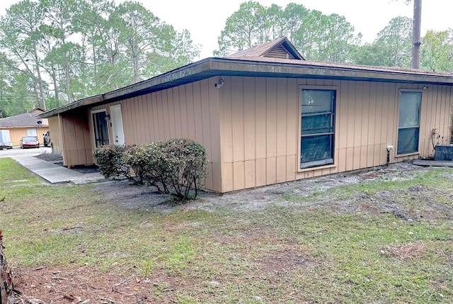 view of home's exterior with a yard