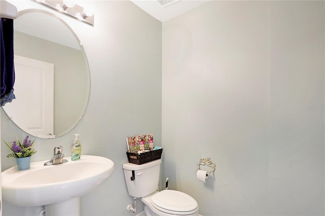 bathroom featuring sink and toilet