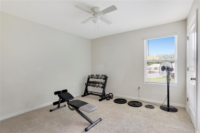 exercise area featuring ceiling fan and light colored carpet