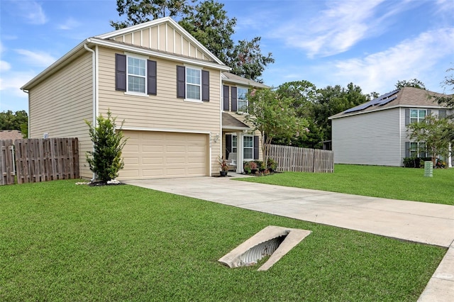 view of front of property with a front yard and a garage