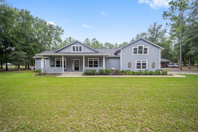 view of front of house with a porch and a front yard