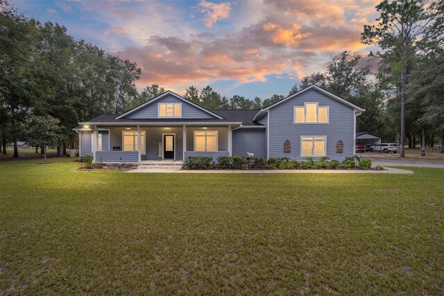 view of front of home featuring a yard and a porch