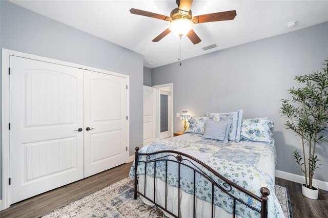 bedroom featuring a closet, ceiling fan, and wood-type flooring