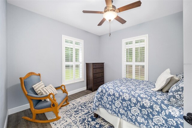 bedroom featuring dark wood-type flooring and ceiling fan