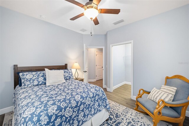 bedroom featuring ceiling fan and light wood-type flooring