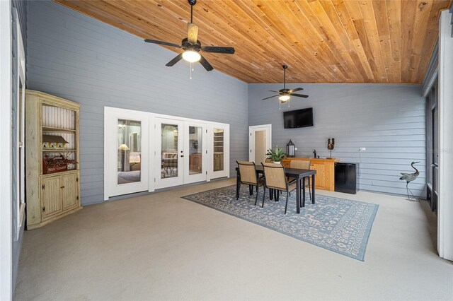 dining space featuring french doors, high vaulted ceiling, wood ceiling, and ceiling fan