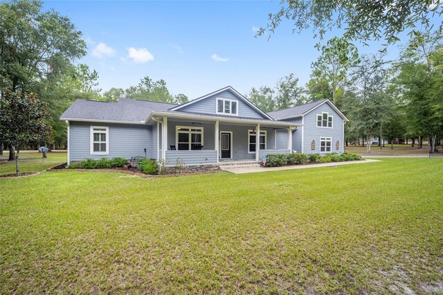 view of front facade with a front yard and a porch