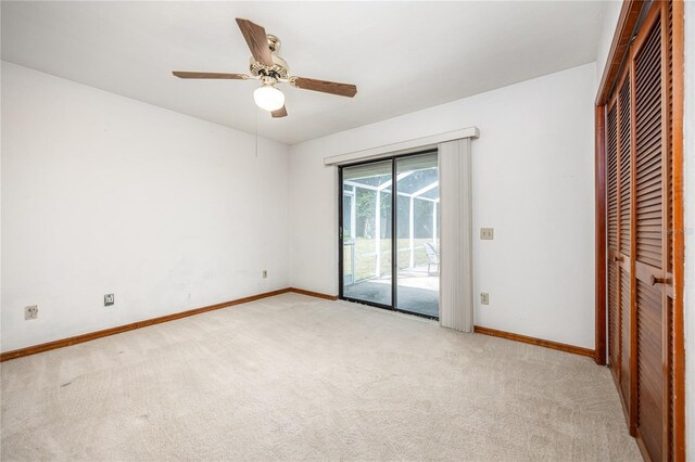 unfurnished bedroom with light colored carpet, access to outside, ceiling fan, and a closet