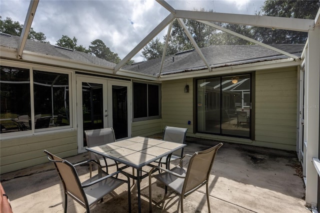 view of patio featuring a lanai