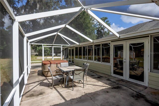 sunroom / solarium with vaulted ceiling and french doors