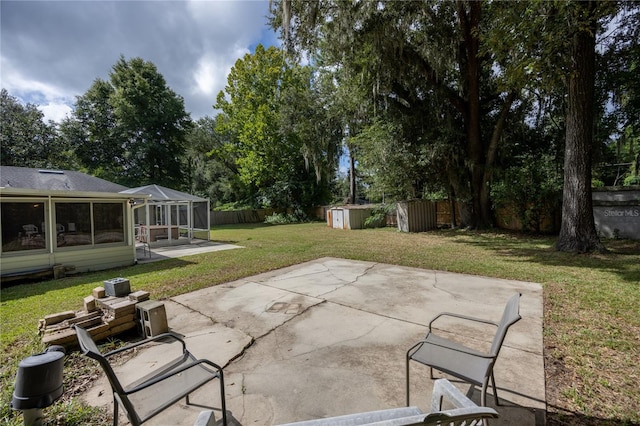 view of patio with a shed and a sunroom