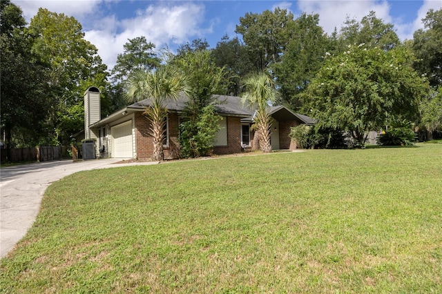 view of front of home with a garage, central AC unit, and a front lawn