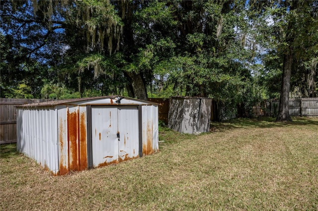 view of outdoor structure with a lawn