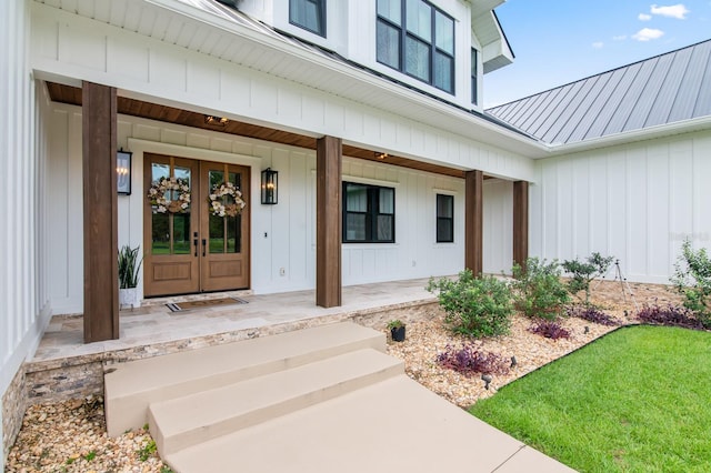 property entrance featuring french doors and covered porch