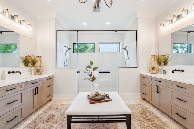 bathroom featuring a tile shower, ornamental molding, and vanity