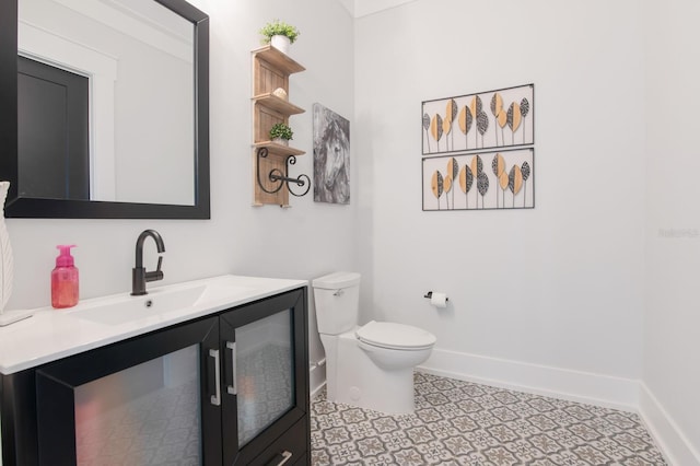 bathroom with toilet and vanity