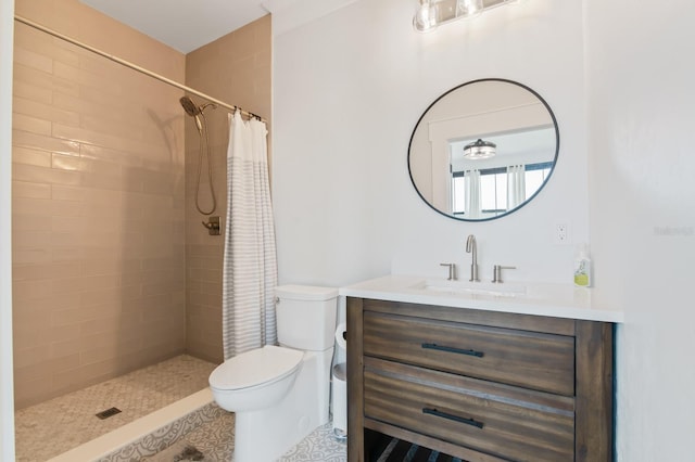 bathroom featuring toilet, vanity, and a shower with curtain