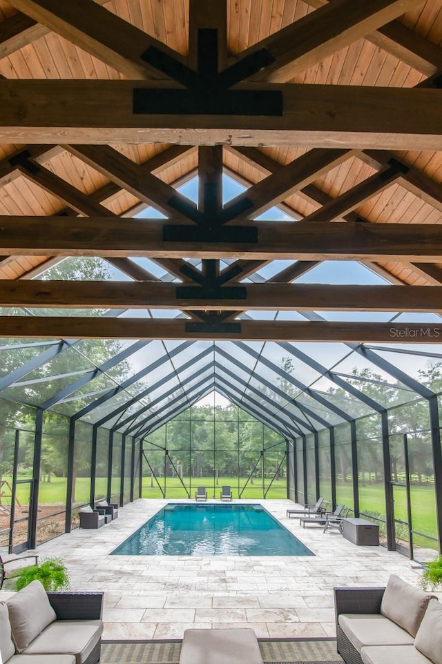 view of pool featuring a patio area, a lanai, and an outdoor hangout area