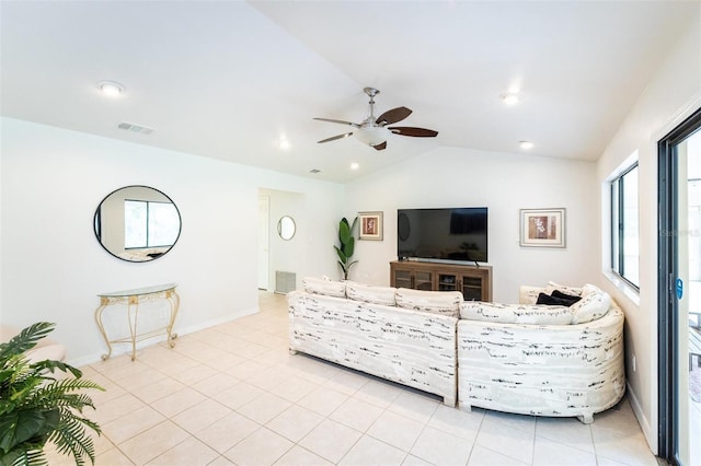 living room with light tile patterned floors, ceiling fan, and lofted ceiling