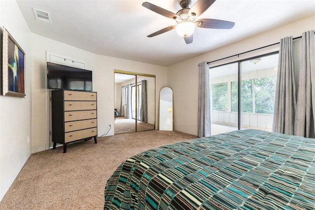 bedroom featuring ceiling fan, a closet, and carpet