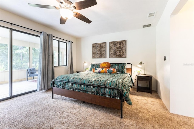 bedroom featuring ceiling fan, access to exterior, and light colored carpet