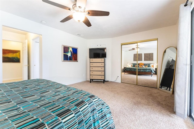 bedroom featuring ceiling fan, a closet, and carpet