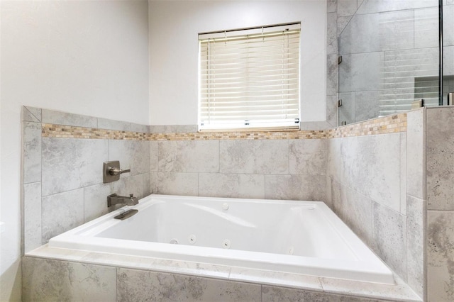 bathroom with tiled bath