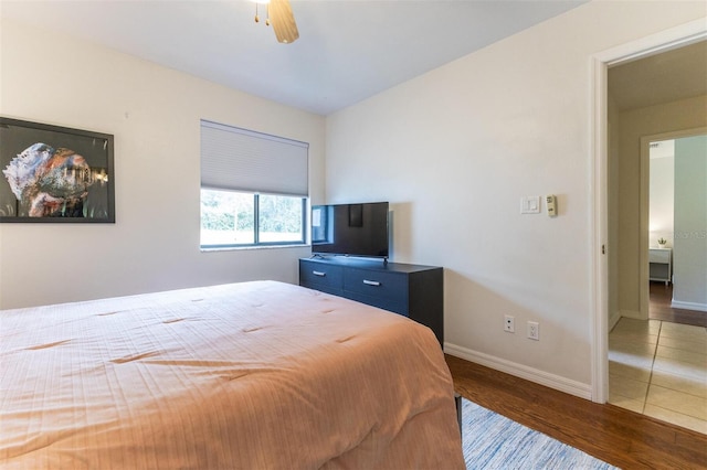 bedroom featuring ceiling fan and dark wood-type flooring