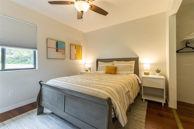 bedroom with hardwood / wood-style flooring and ceiling fan