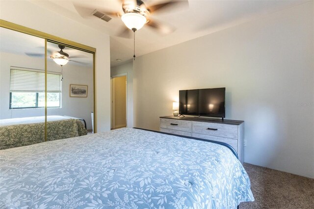 bedroom featuring carpet, a closet, and ceiling fan