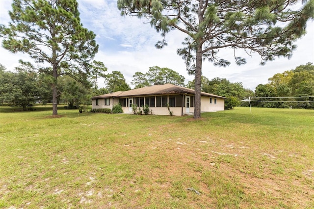 view of yard with a sunroom