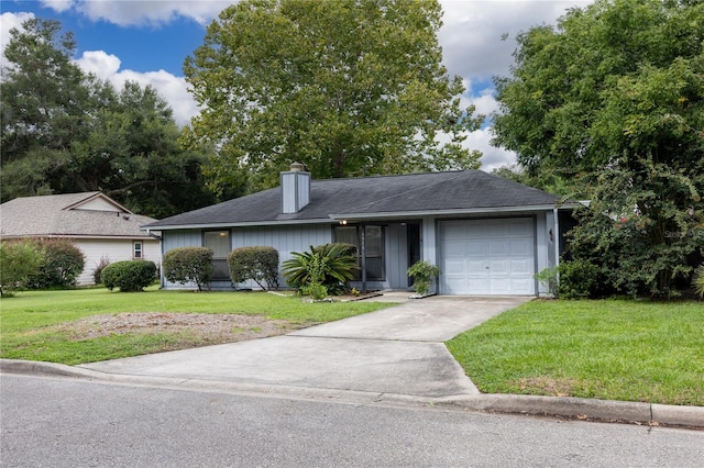 ranch-style home featuring a garage and a front yard