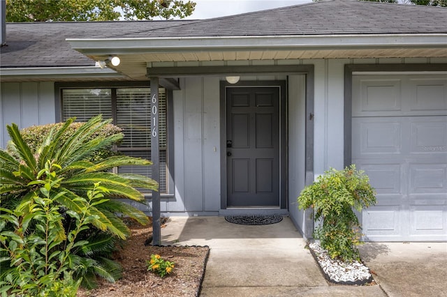 doorway to property featuring a garage