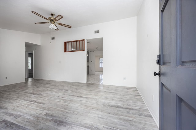 interior space with ceiling fan and light hardwood / wood-style floors