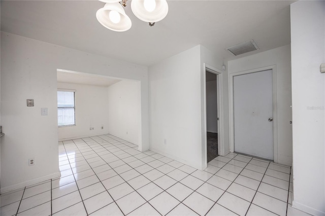 empty room featuring light tile patterned floors