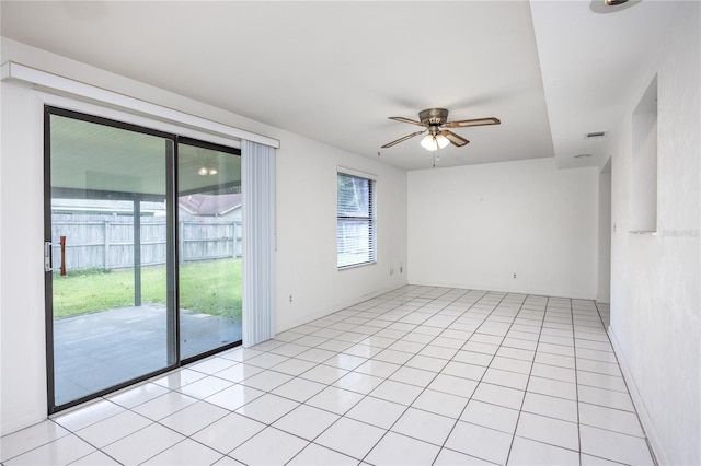 empty room featuring light tile patterned floors and ceiling fan