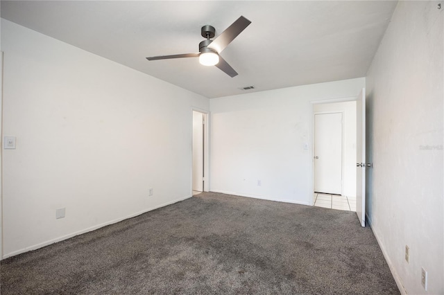 carpeted empty room with ceiling fan