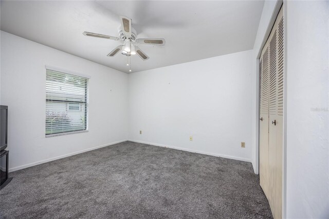 unfurnished bedroom with carpet, ceiling fan, and a closet