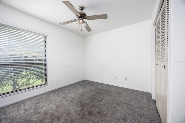 unfurnished bedroom with a closet, ceiling fan, and carpet