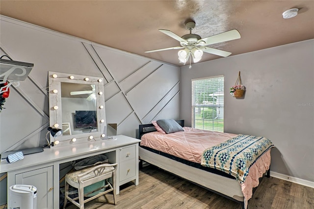 bedroom with ceiling fan and light wood-type flooring