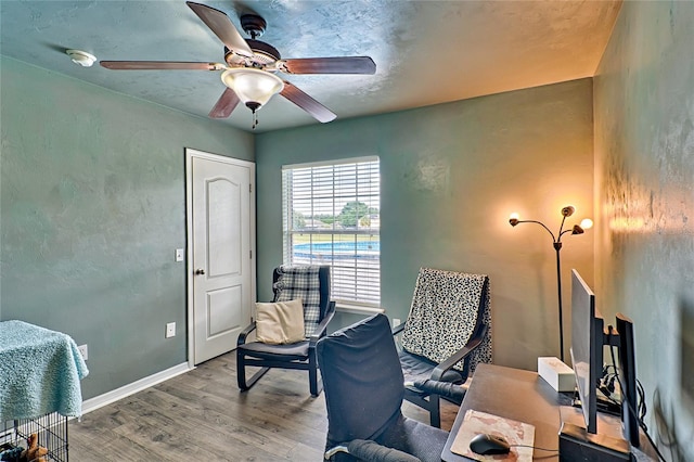 office space featuring ceiling fan and hardwood / wood-style flooring