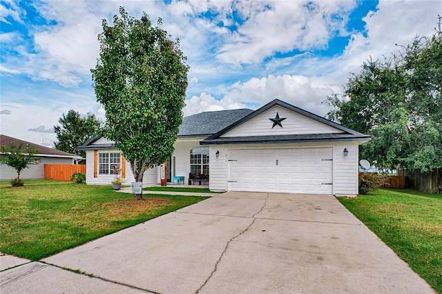 single story home featuring a garage and a front lawn