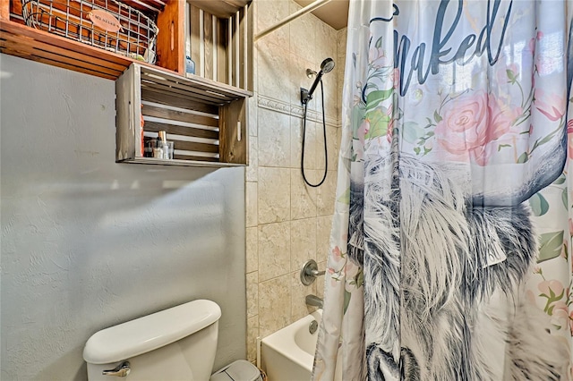 bathroom with a textured wall, toilet, and shower / tub combo with curtain