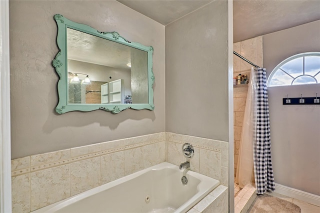 bathroom with a stall shower, a jetted tub, and tile patterned floors