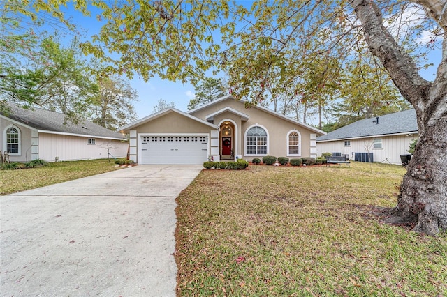 ranch-style home featuring stucco siding, driveway, an attached garage, and a front yard